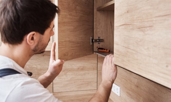 man-open-kitchen-cupboard