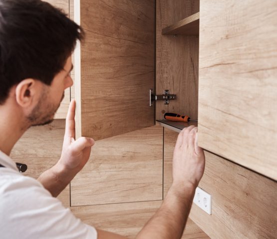 man-open-kitchen-cupboard